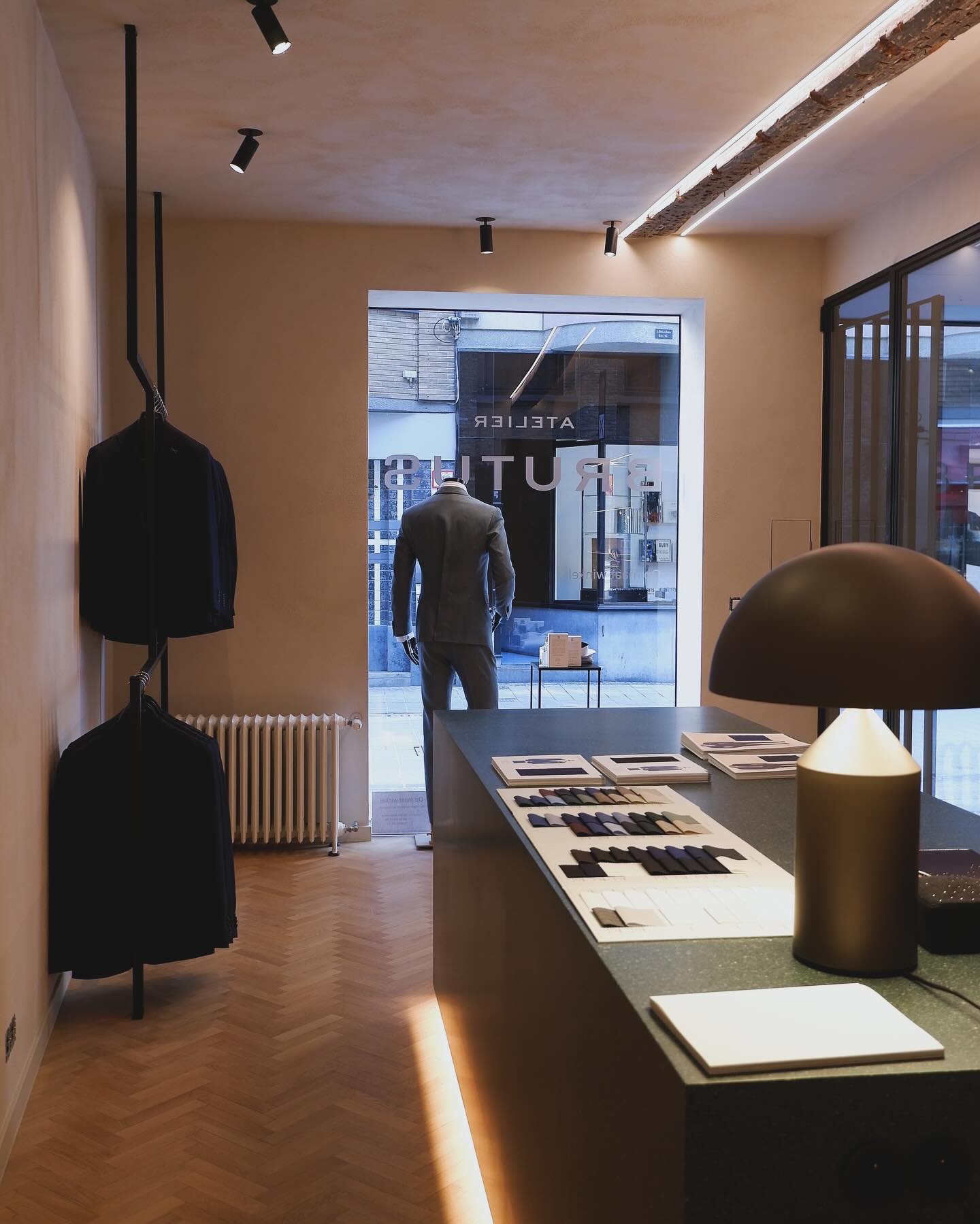 Master tailor chalking a bespoke jacket